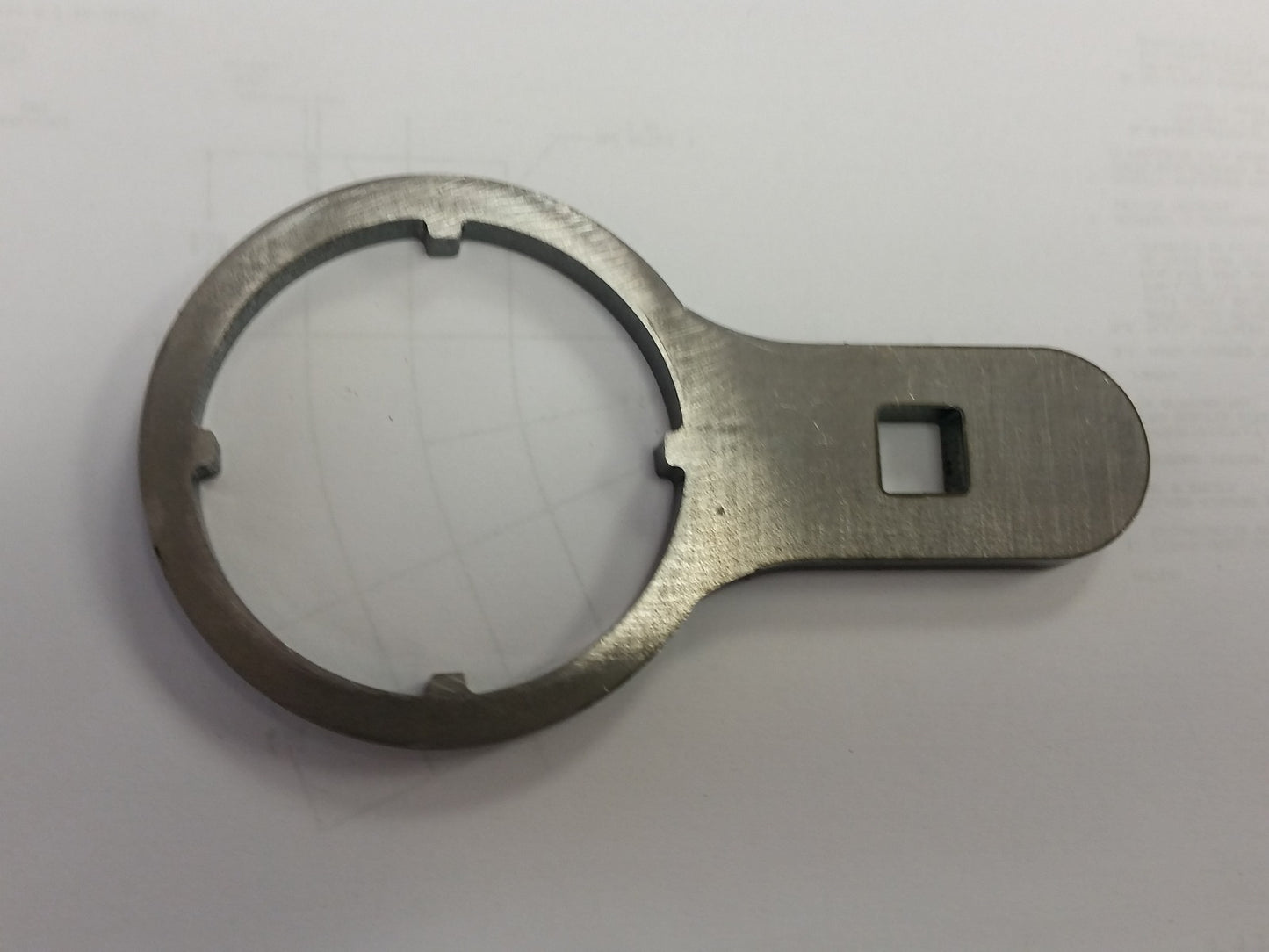 Special wrench to remove and reinstall locking nut on portal box shaft.