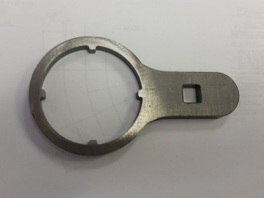 Special wrench to remove and reinstall locking  nut on portal box shaft. 