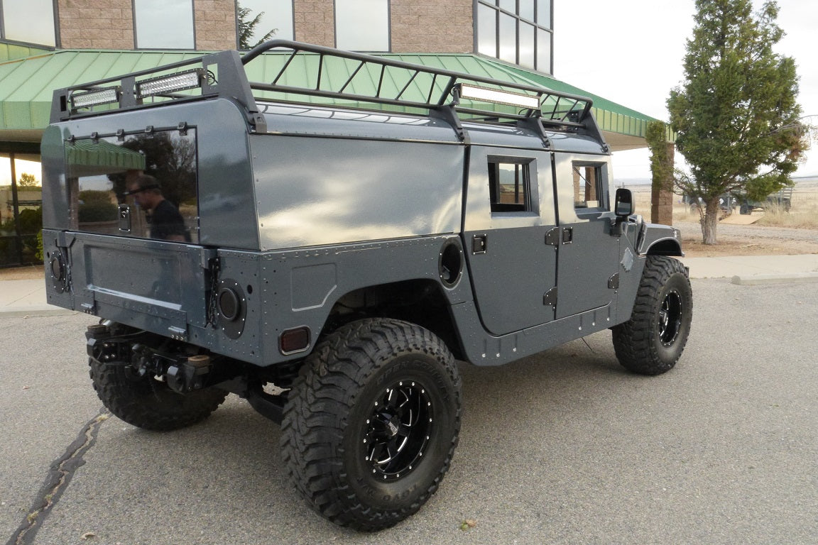 Powder-coated humvee roof rack with LED light bars attached