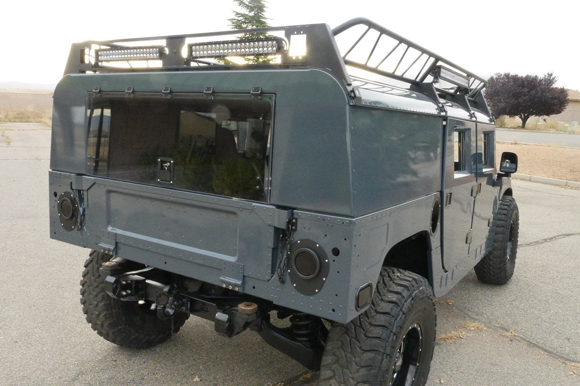 Rear view of powder-coated aluminum wagon back with polycarbonate lift gate for humvee